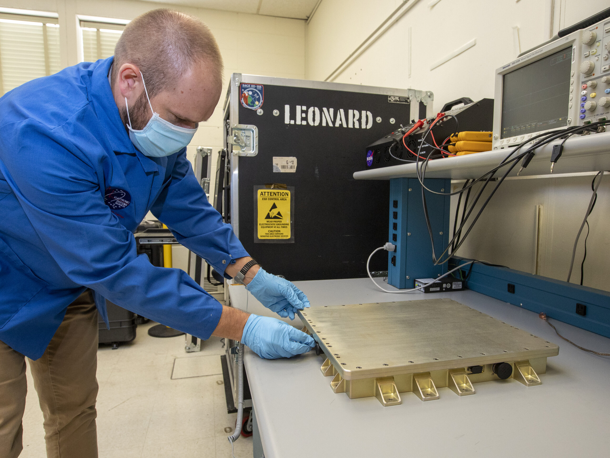 Stephen Bowen with the CLARREO-PF PCU before it's shipped to LASP. Photo Credit: NASA/Dave Bowman