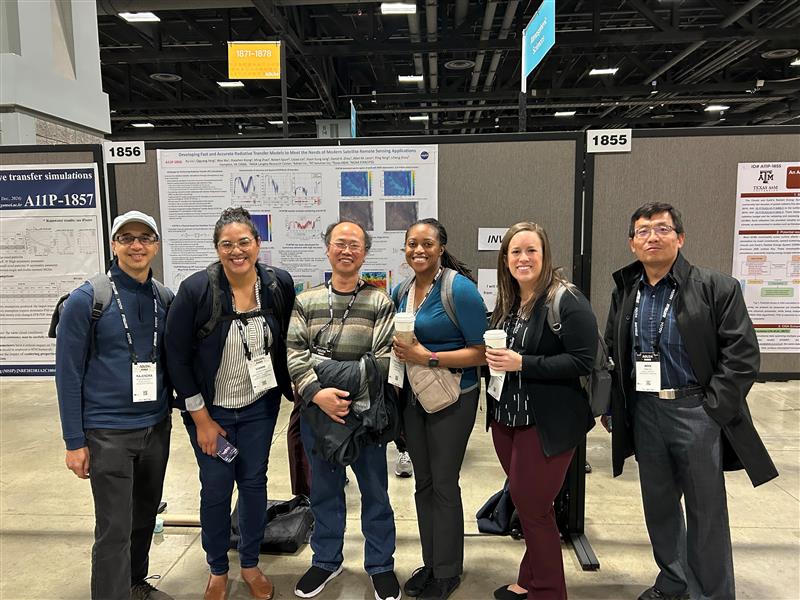 Members of the CLARREO Pathfinder Team peruse the posters at the poster session at the AGU Fall Annual Meeting in December 2024.